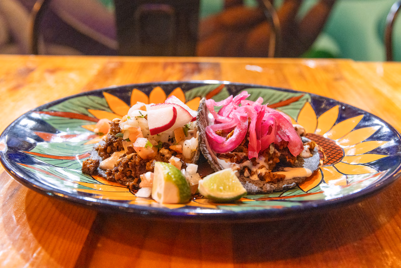 Mis Tacones signature dishes Taco Al Pastor Cali BNacho Pollo